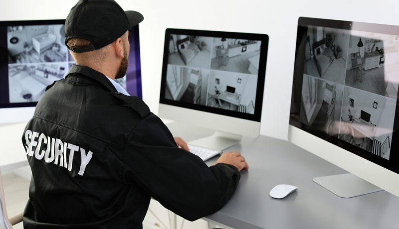 Male Security Guard Monitoring Network