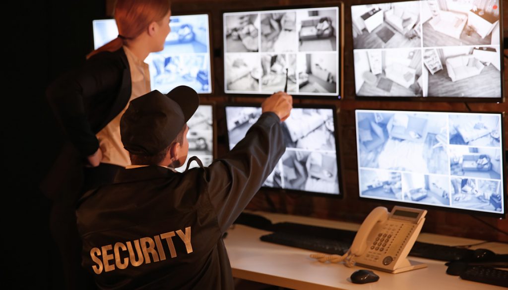 Security guards working in surveillance room
