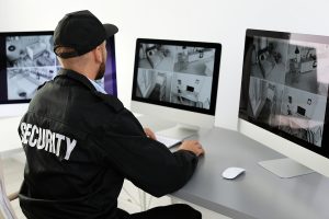 Male Security Guard Monitoring Network