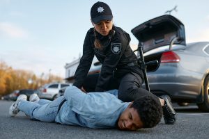 Security Officer Arresting Suspect in Parking Lot